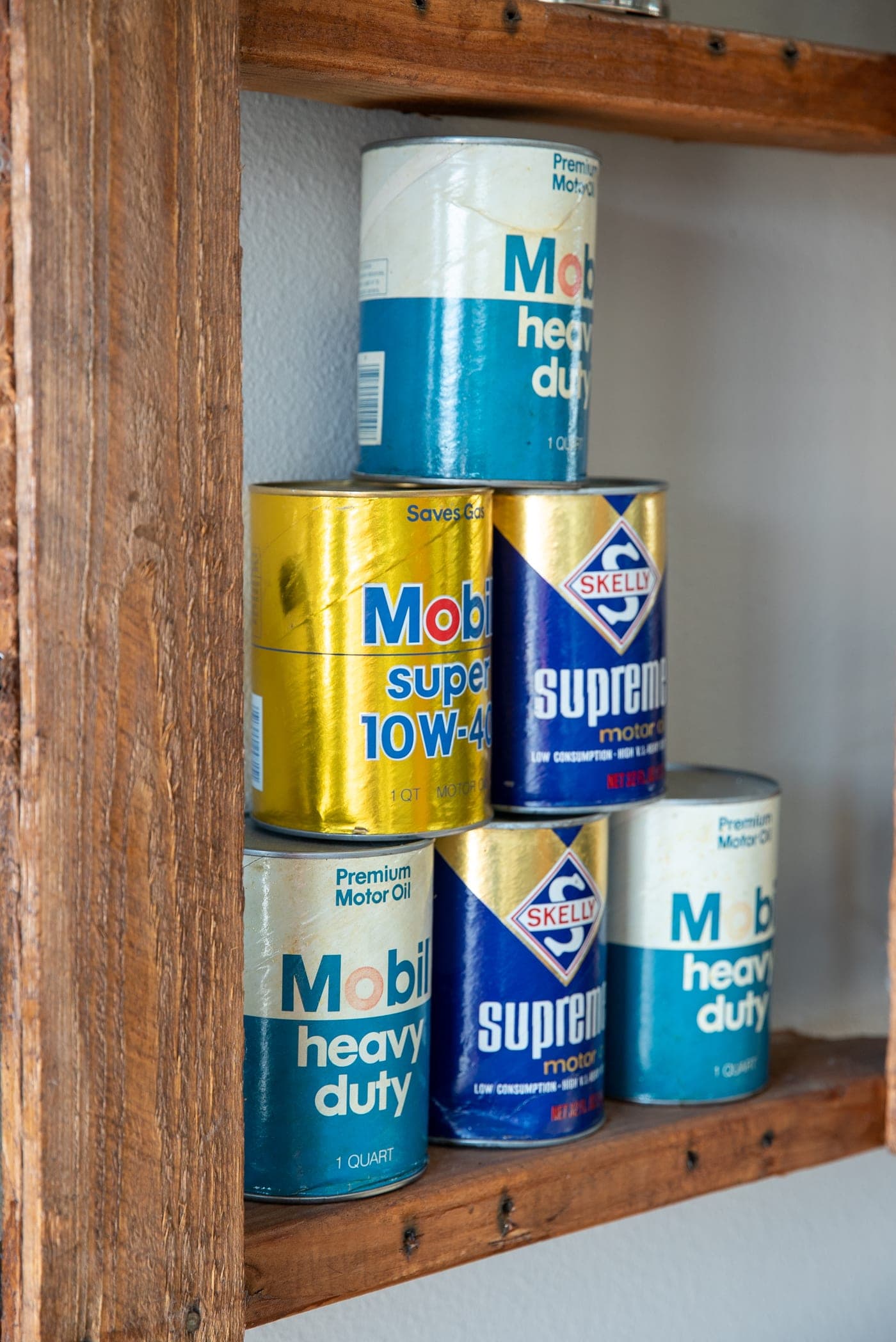 Vintage motor-oil cans on display in the Scappoose lobby
